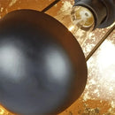 Adjustable industrial floor lamp with flexible tripod for modern interiors