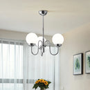 Minimalist glass and iron pendant light for modern spaces