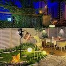 Fairy garden decoration with watering can and solar lanterns
