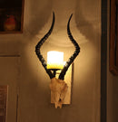 Sheep horn wall light for industrial decor