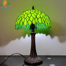 Tiffany style table lamp with decorative green leaves