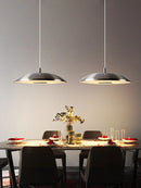 Minimalist circular pendant light with flying saucer design