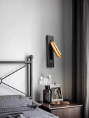 Rotating brass LED wall light with USB switch