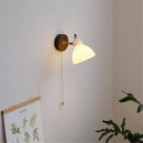 Modern glass and brass wall light with switch