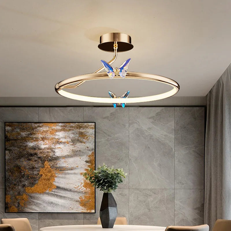 Gold ring LED pendant light with butterfly motif