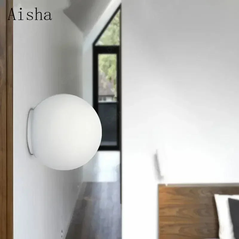Modern LED wall light with round white glass shade