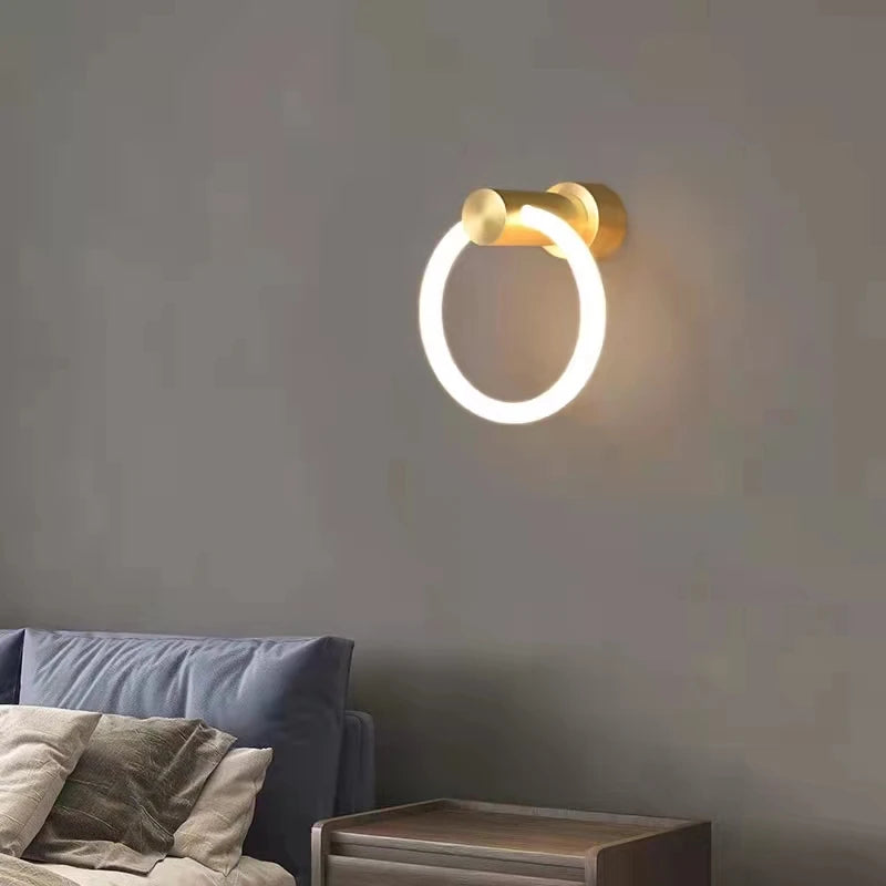 Modern brass LED wall light with acrylic ring, 3 colour dimmable