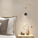 Minimalist copper and brass wall light