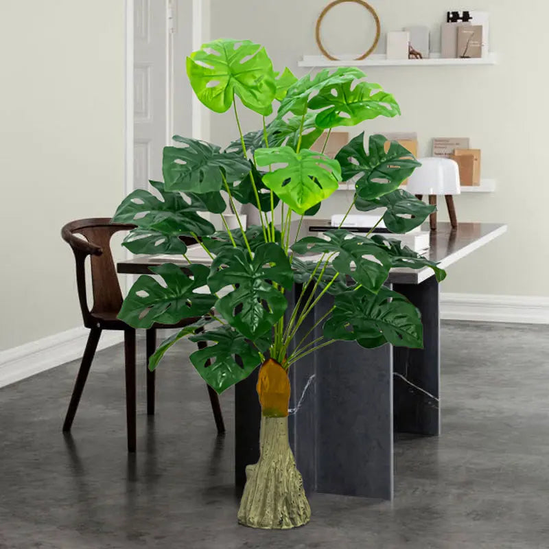 Large artificial palm tree with monstera leaves for outdoor and indoor decor