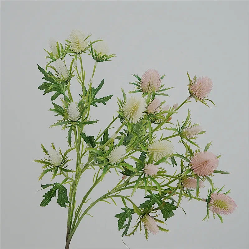 Decorative artificial sea holly flowers in pink and violet