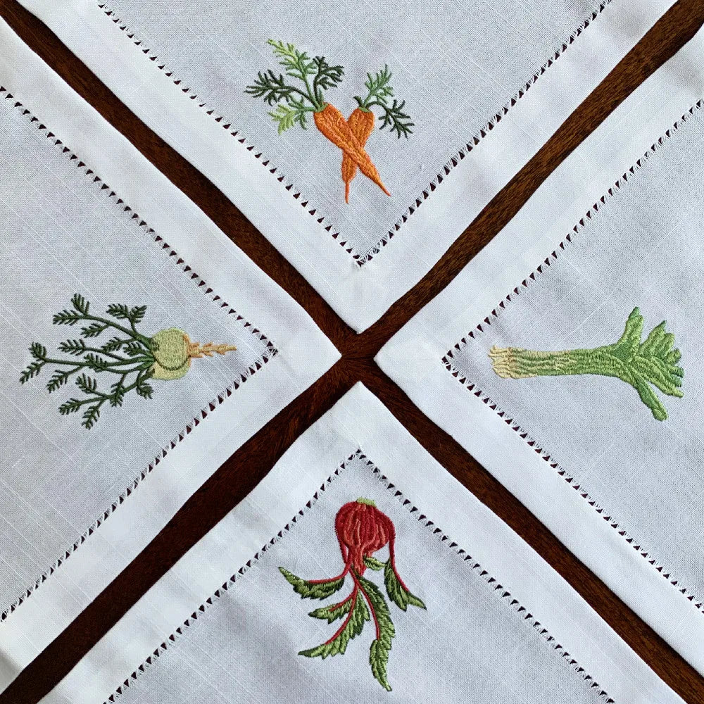 Embroidered linen cotton napkin with vegetable motifs and hemstitch detail