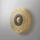Carved copper wall light with decorative LED lighting