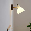 Modern glass and brass wall light with switch