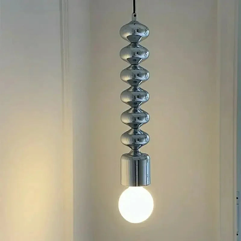 Modern industrial chrome bedside lamp with long wavy line