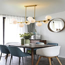 Suspended copper chandelier with glass globe for interior decoration