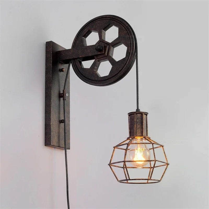Retro pulley wall light in decorative wrought iron for interiors