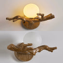 Vintage LED wall light in resin tree branch design