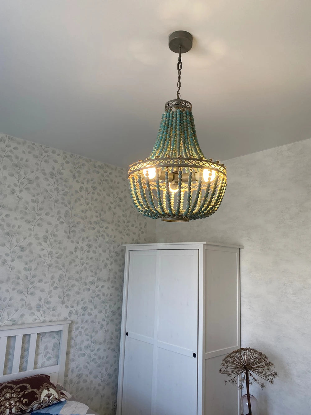 Modern vintage chandelier with wooden beads for elegant interiors