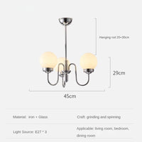 Minimalist glass and iron pendant light for modern spaces