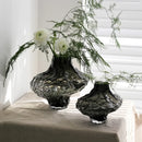 glass vase with decorative stones for flowers and terrarium