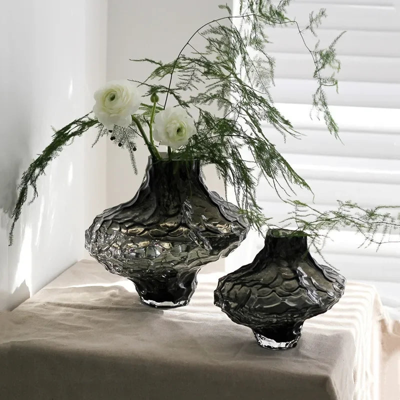 glass vase with decorative stones for flowers and terrarium