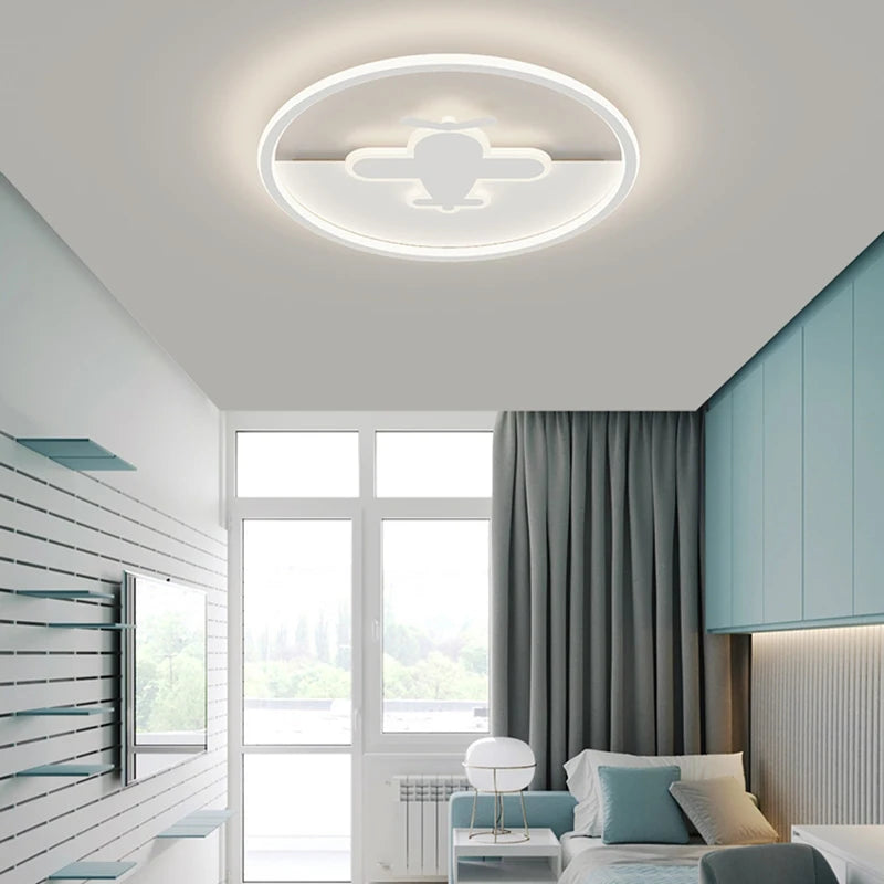 Scandinavian round ceiling light with airplane and cloud motif for children