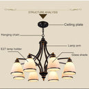 Vintage iron and bronze chandelier with glass shade, loft style