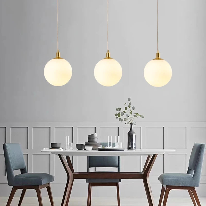 Minimalist brass pendant light with milky glass orb - vue 6 sur 9