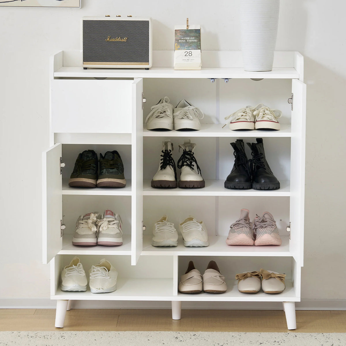 minimalist storage unit with adjustable shelves and wooden legs