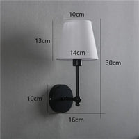 American retro wall light in black and gold linen