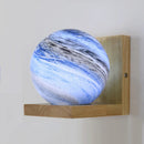 Modern wooden wall light with planet LED shade