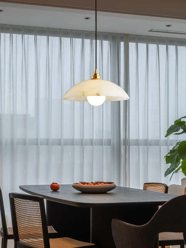 Minimalist marble and copper pendant light for modern interiors