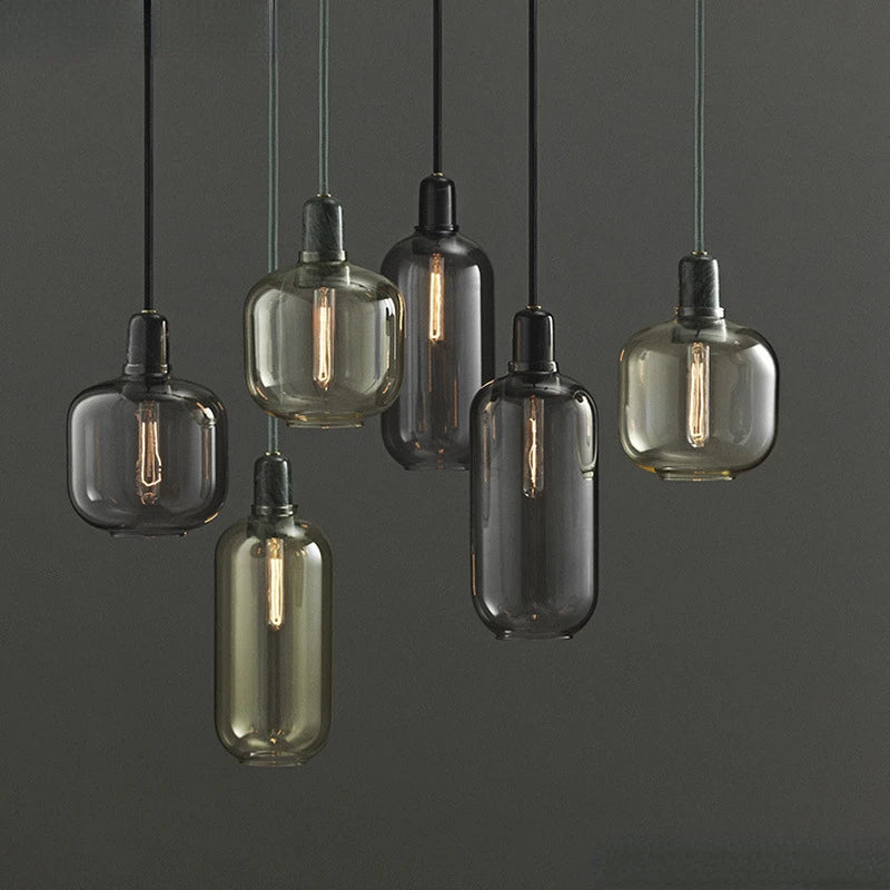 Glass pendant light with marble detail, elegant industrial design