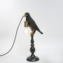 Modern resin bird-shaped desk lamp with golden beak
