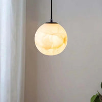 Nordic marble pendant light with elegant suspended globe