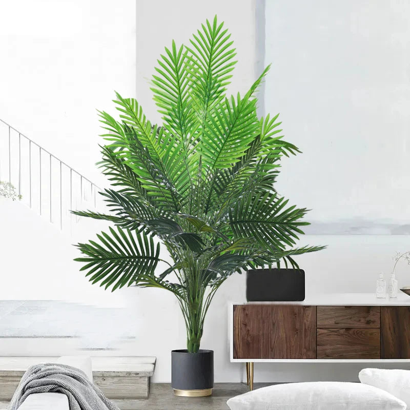 Artificial palm tree with plastic monstera leaves for garden