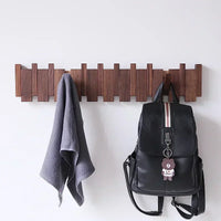hanging walnut coat rack with creative solid wood hooks