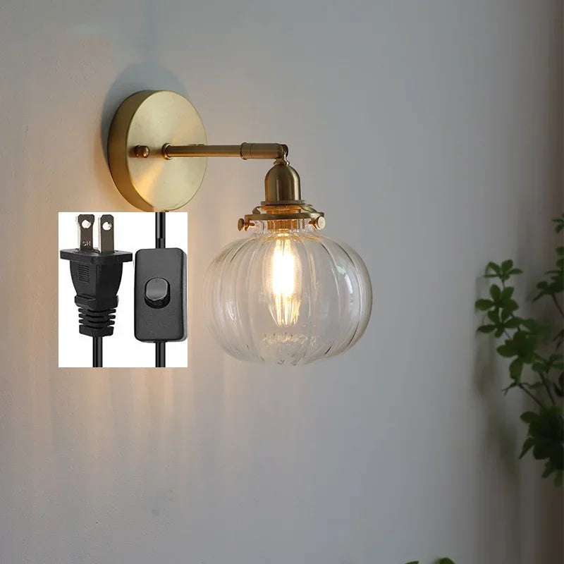 Modern wall light with pull chain and glass globe