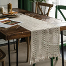 Beige boho table runner with geometric pattern and tassels