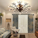 Vintage black metal chandelier with crystal pendants for modern interiors