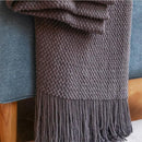 Nordic style knitted throw with pom poms for living room