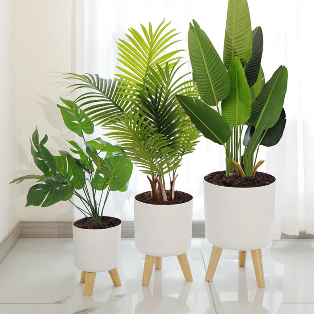 round flower pot on wooden stand for plants