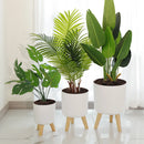 round flower pot on wooden stand for plants