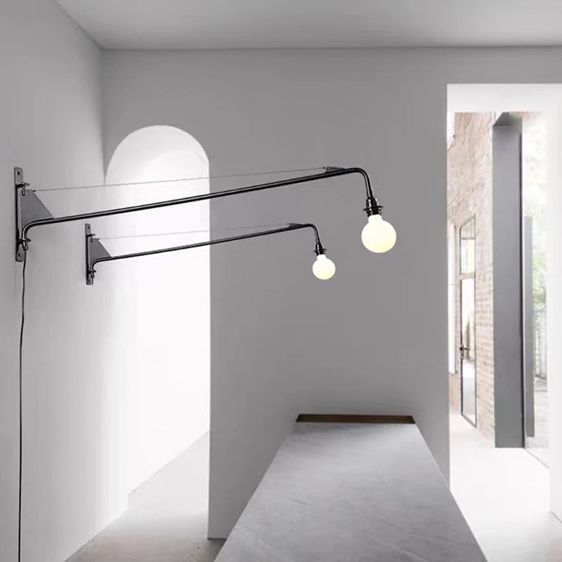 Minimalist wall light with long arm and rotary switch