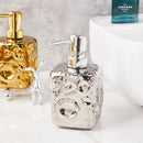 golden ceramic bottle with moon decor for lotion