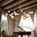 Designer branch-effect resin chandelier with glass ball