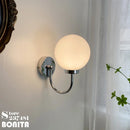 Elegant and modern chrome and milky glass wall light