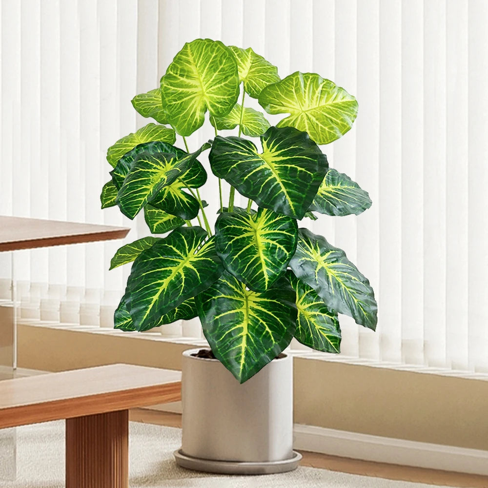 Artificial tropical turtle with decorative branches and leaves