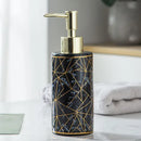 ceramic soap dispenser with gold pump for bathroom