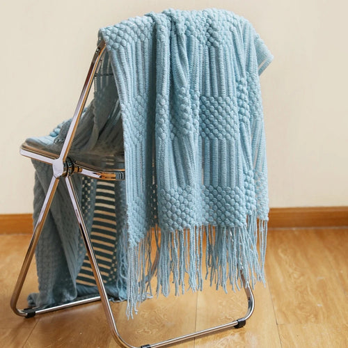 Lightweight knitted throw with pom-poms cosy style for sofa